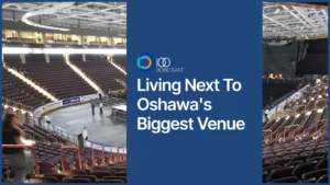 Interior of Tribute Communities Centre in Oshawa with tiered seating and a stage titled "Living Next To Oshawa's Biggest Venue."